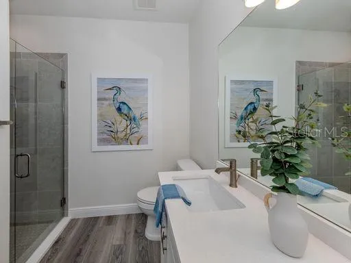 a white bath tub sitting next to a white sink