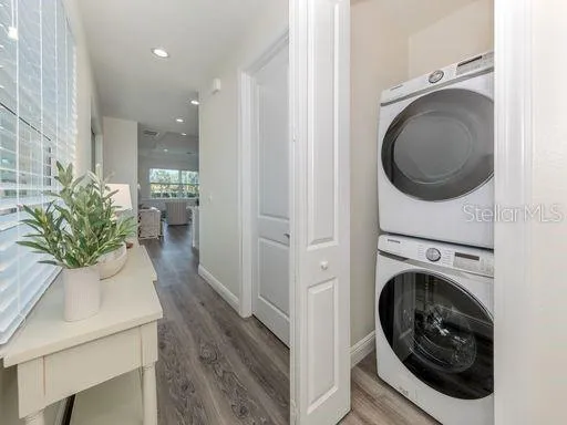a view of a hallway with washer and dryer