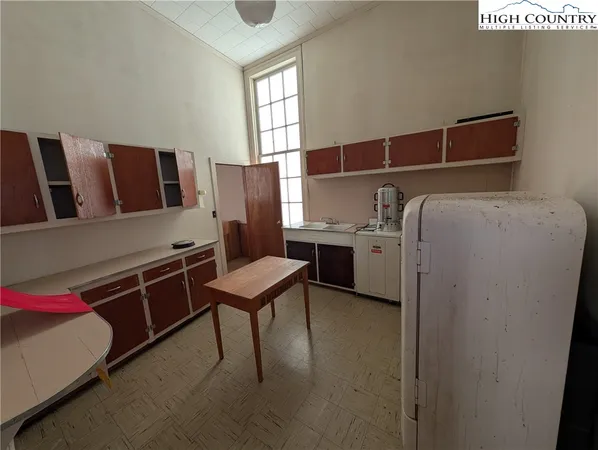 a bedroom with a bed and furniture