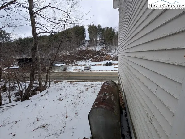 a view of a backyard of the house