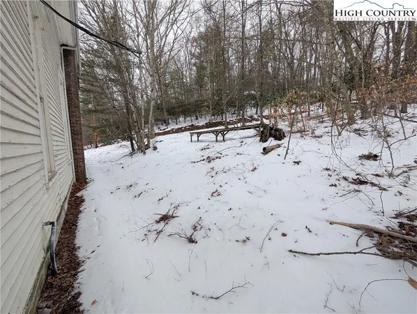 a view of a backyard of the house