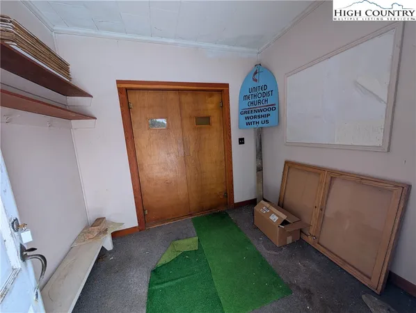 a view of an entryway with a door