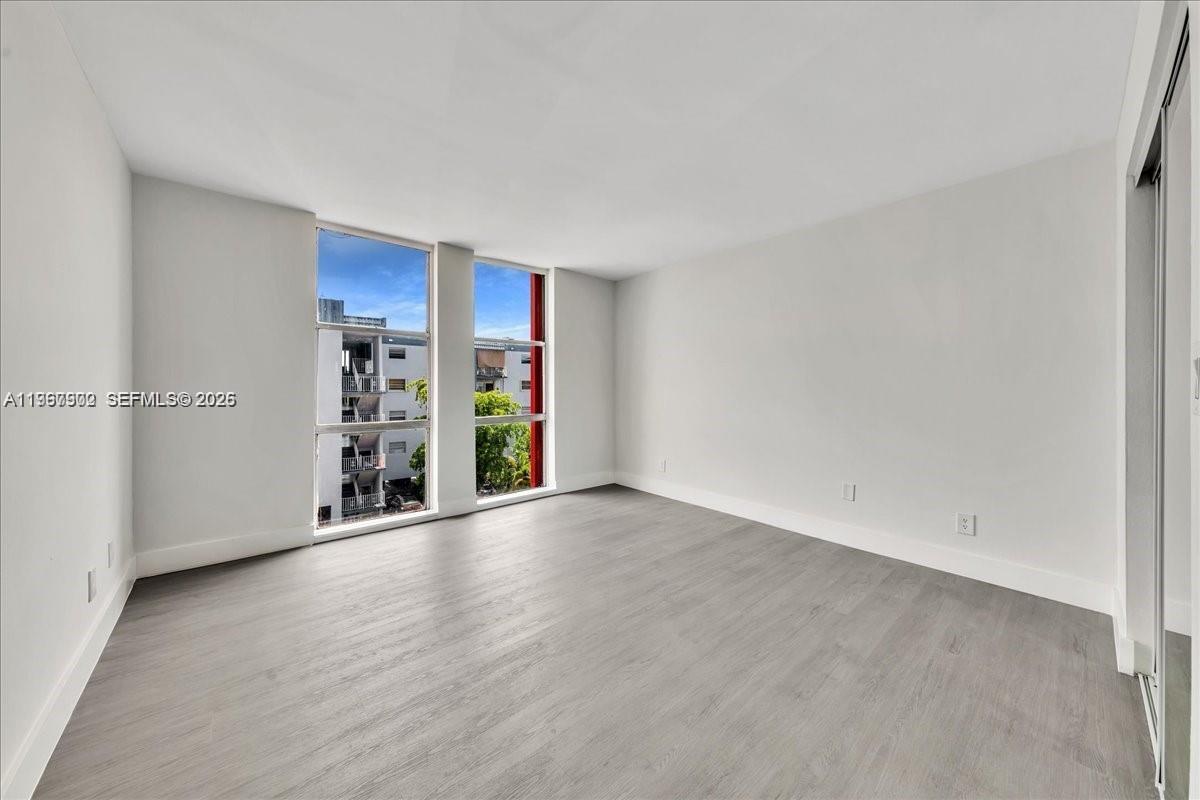 1750 West 46th Street, Unit 433 Hialeah, FL 33012 - Photo 14 of 27 an empty room with shelves
