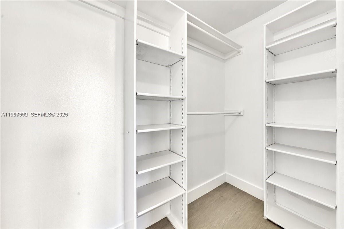 1750 West 46th Street, Unit 433 Hialeah, FL 33012 - Photo 18 of 27 a view of walk in closet with empty racks