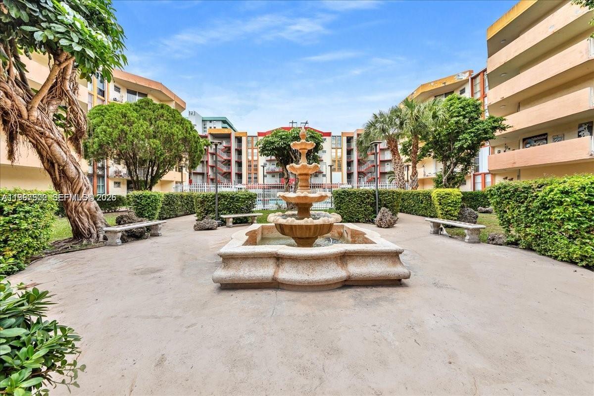 1750 West 46th Street, Unit 433 Hialeah, FL 33012 - Photo 23 of 27 a view of a street with a cars parked in front of it