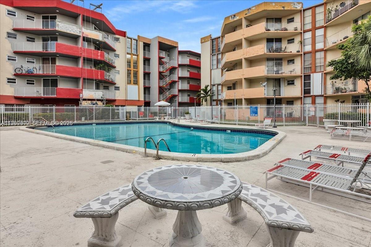 1750 West 46th Street, Unit 433 Hialeah, FL 33012 - Photo 24 of 27 a front view of a building and outdoor space