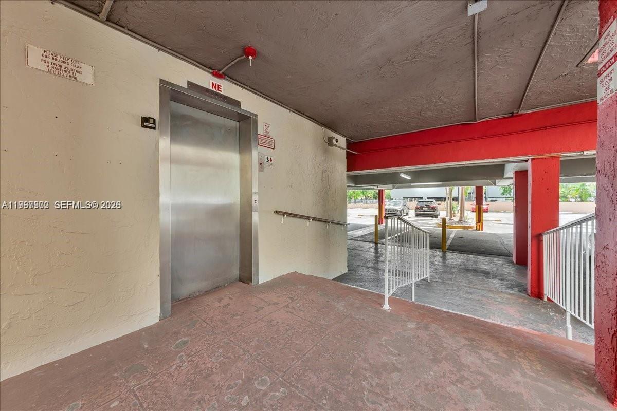 1750 West 46th Street, Unit 433 Hialeah, FL 33012 - Photo 25 of 27 a view of a room with wooden floor and a fireplace