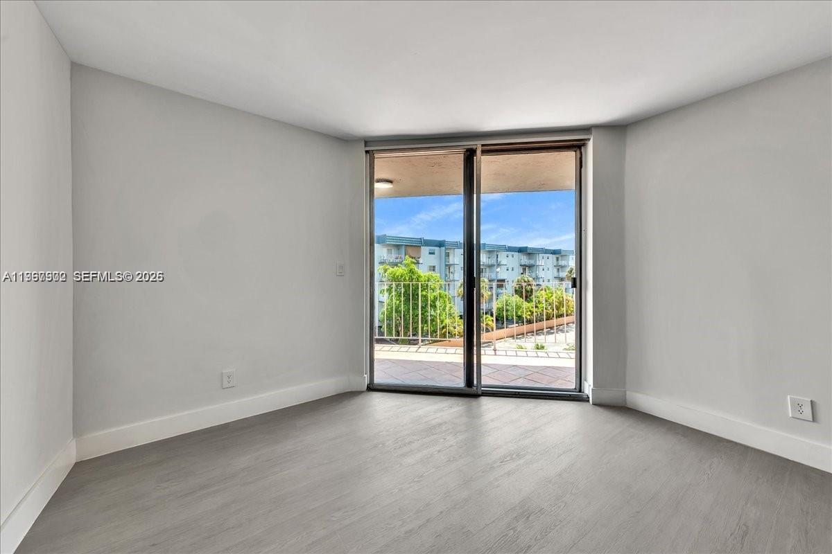 1750 West 46th Street, Unit 433 Hialeah, FL 33012 - Photo 7 of 27 a view of an empty room with a window