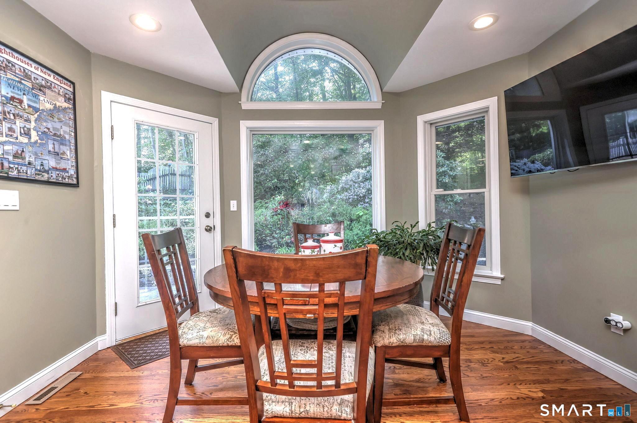 60 West Meadow Road Hamden, CT 06518 - Photo 10 of 35 The breakfast nook with beautiful views of the gardens. Out the divided light door is the patio, convenient to outdoor dining.
