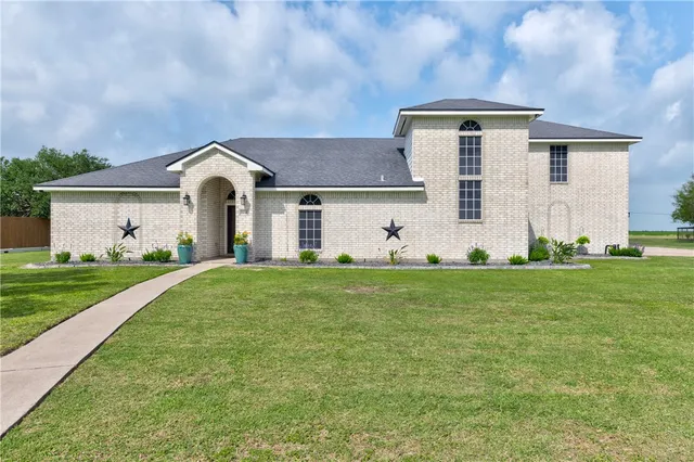a view of a livingroom with furniture and chandelier