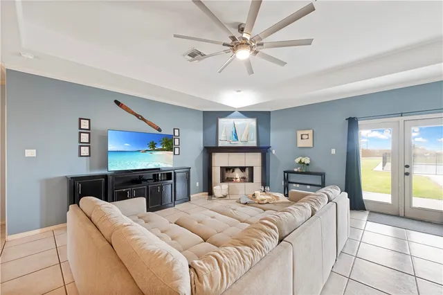 a view of a dining room with furniture and a kitchen
