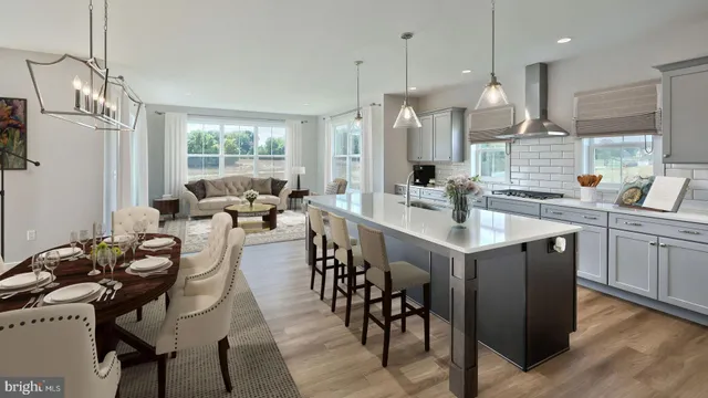 a large kitchen with a table and chairs