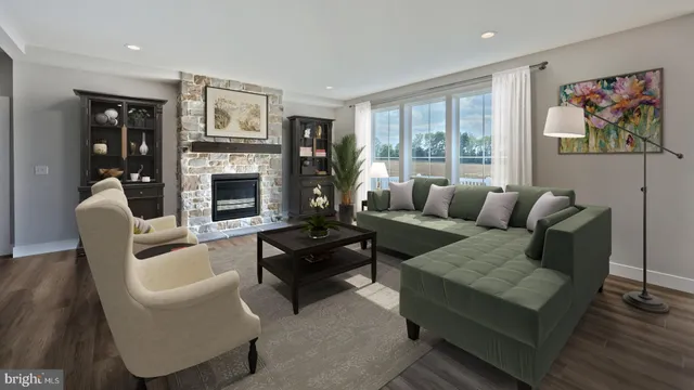 a living room with furniture fireplace and window