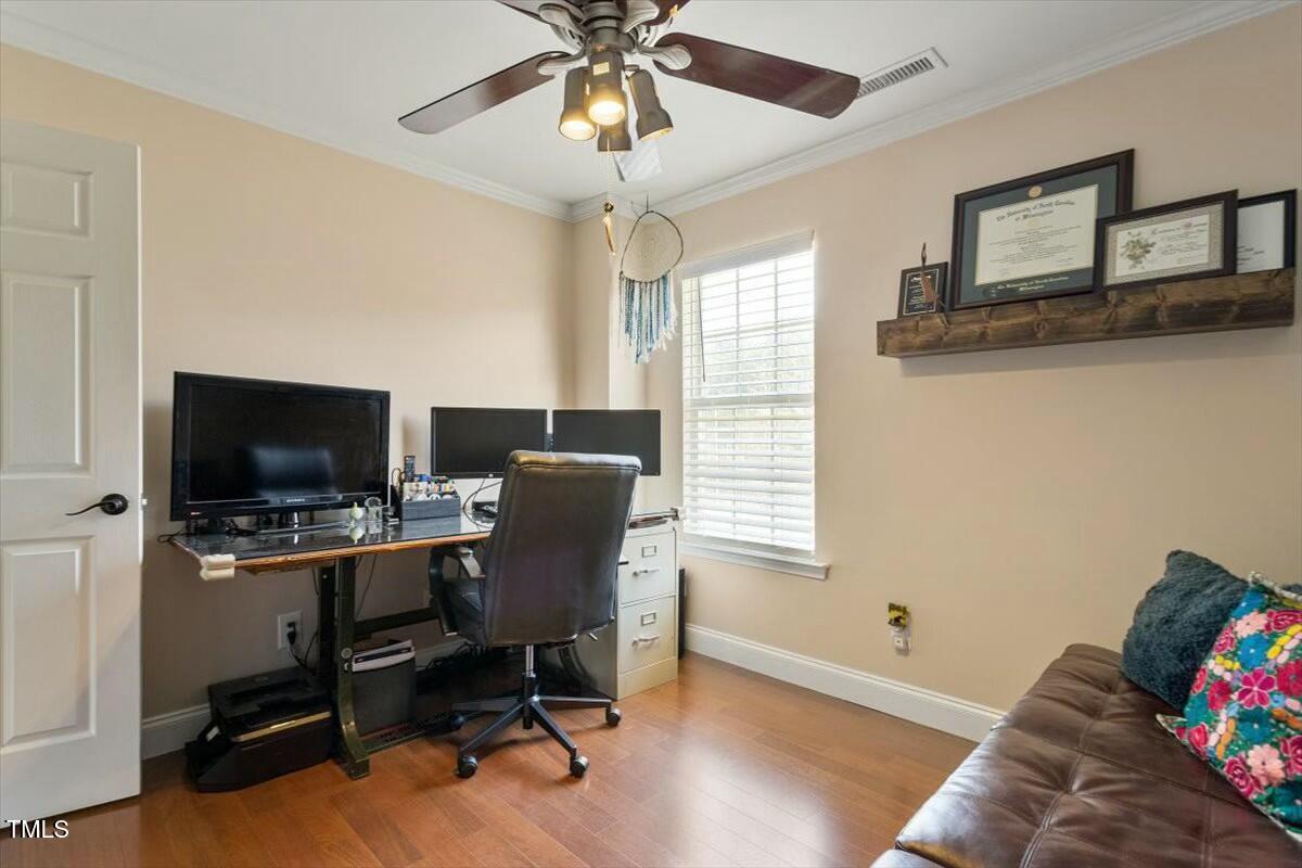1104 Garnet Ridge Way Raleigh, NC 27607 - Photo 15 of 20 a view of a livingroom with workspace and a window
