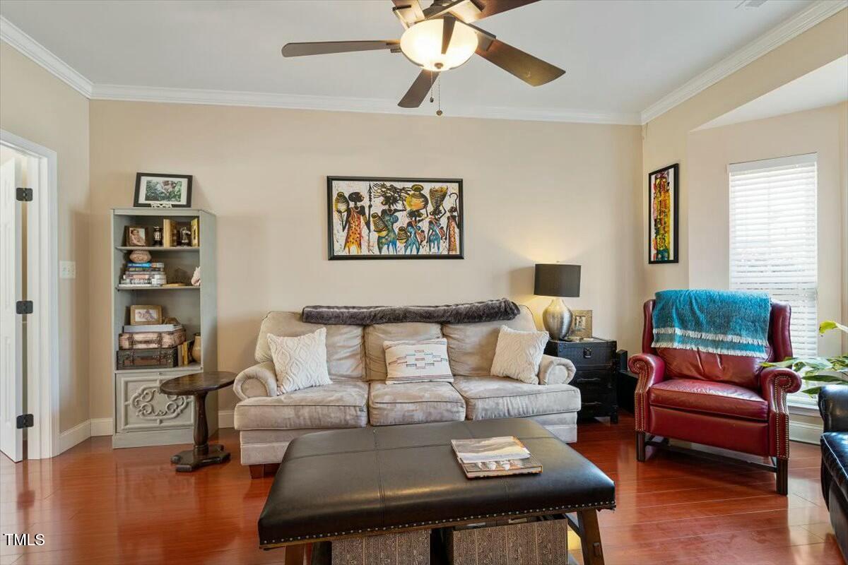 1104 Garnet Ridge Way Raleigh, NC 27607 - Photo 4 of 20 a living room with furniture and a wooden floor