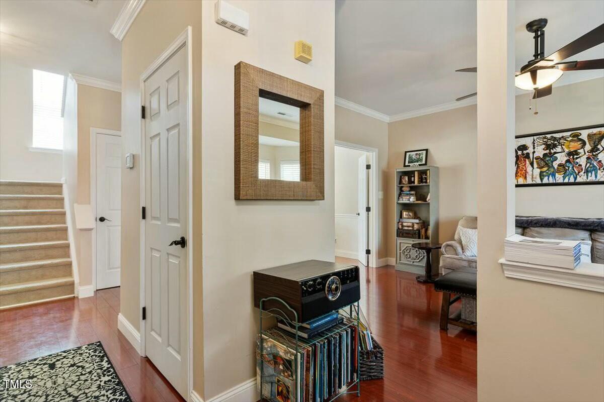 1104 Garnet Ridge Way Raleigh, NC 27607 - Photo 5 of 20 a view of a hallway with workspace and a window