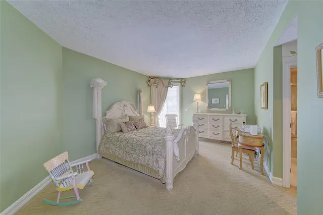 a living room with furniture and a bathroom