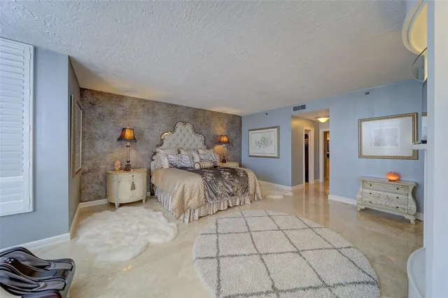 a bedroom with furniture and a table