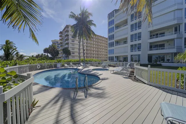 a view of a house with a flower garden