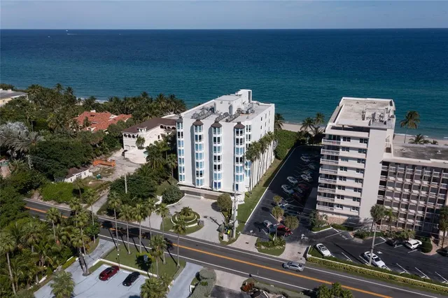 a city view with tall buildings and a yard