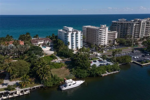 a front view of multi story residential apartment building with yard