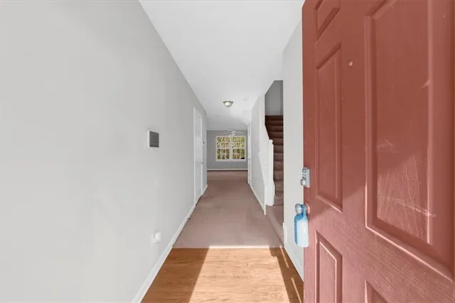 a view of a hallway with white walls