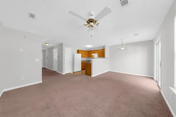a view of a livingroom with a ceiling fan