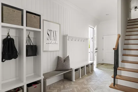 a bedroom with bed and a flat tv screen on dresser