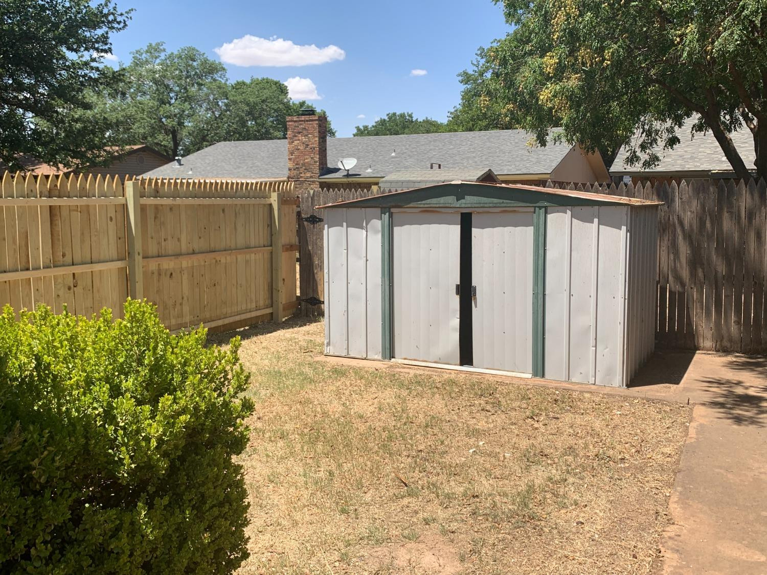 4316 58th Street, Unit A Lubbock, TX 79413 - Photo 10 of 10 a view of a white house with a outdoor space
