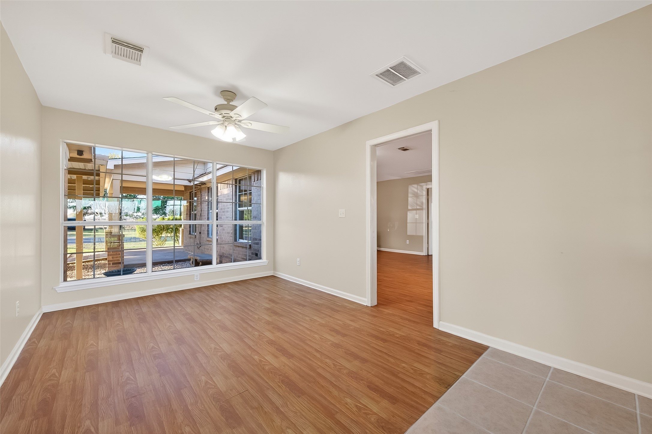 12415 Roesler Road Needville, TX 77461 - Photo 17 of 46 wooden floor in an empty room with a window