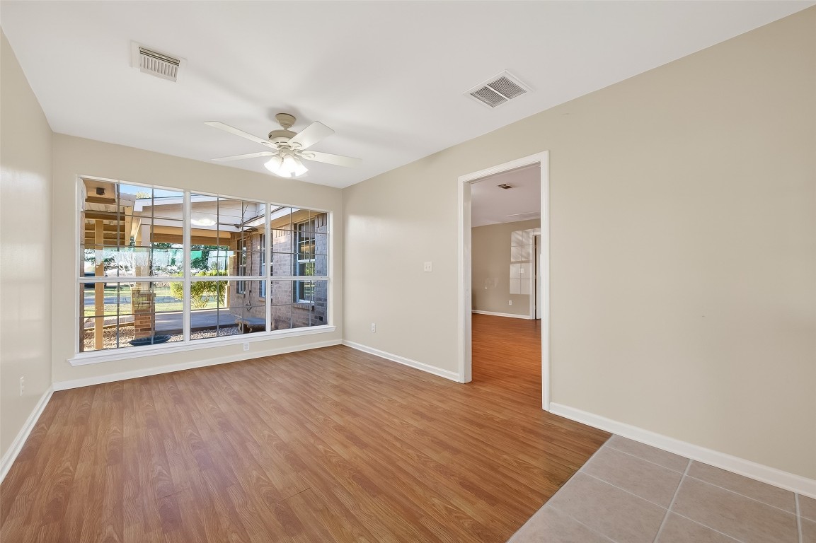 12415 Roesler Road Needville, TX 77461 - Photo 17 of 49 wooden floor in an empty room with a window