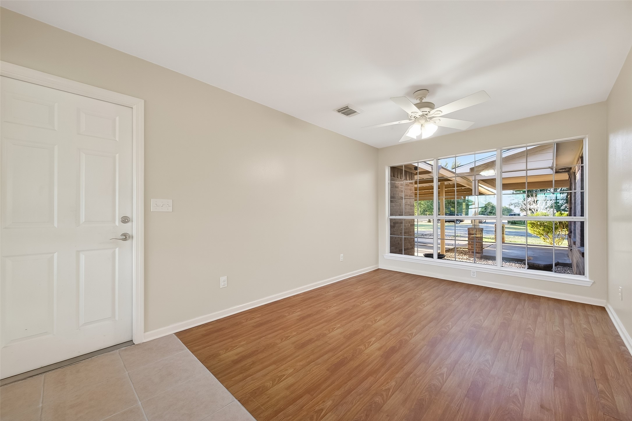 12415 Roesler Road Needville, TX 77461 - Photo 18 of 46 wooden floor in an empty room with a window