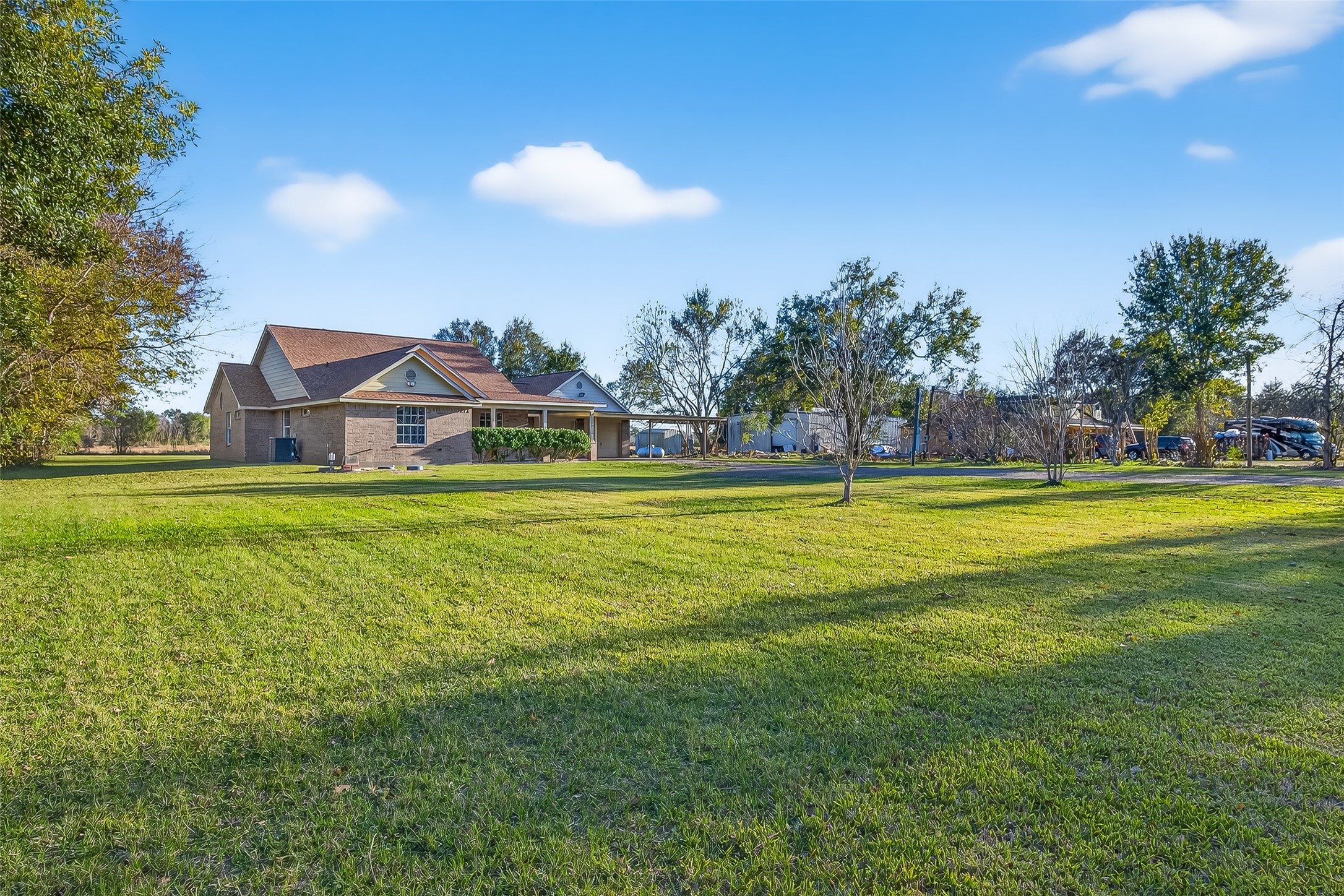 12415 Roesler Road Needville, TX 77461 - Photo 2 of 46 a view of a swimming pool with an outdoor space and seating area
