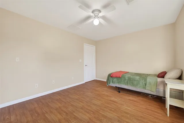 a view of livingroom with hardwood floor and a ceiling fan