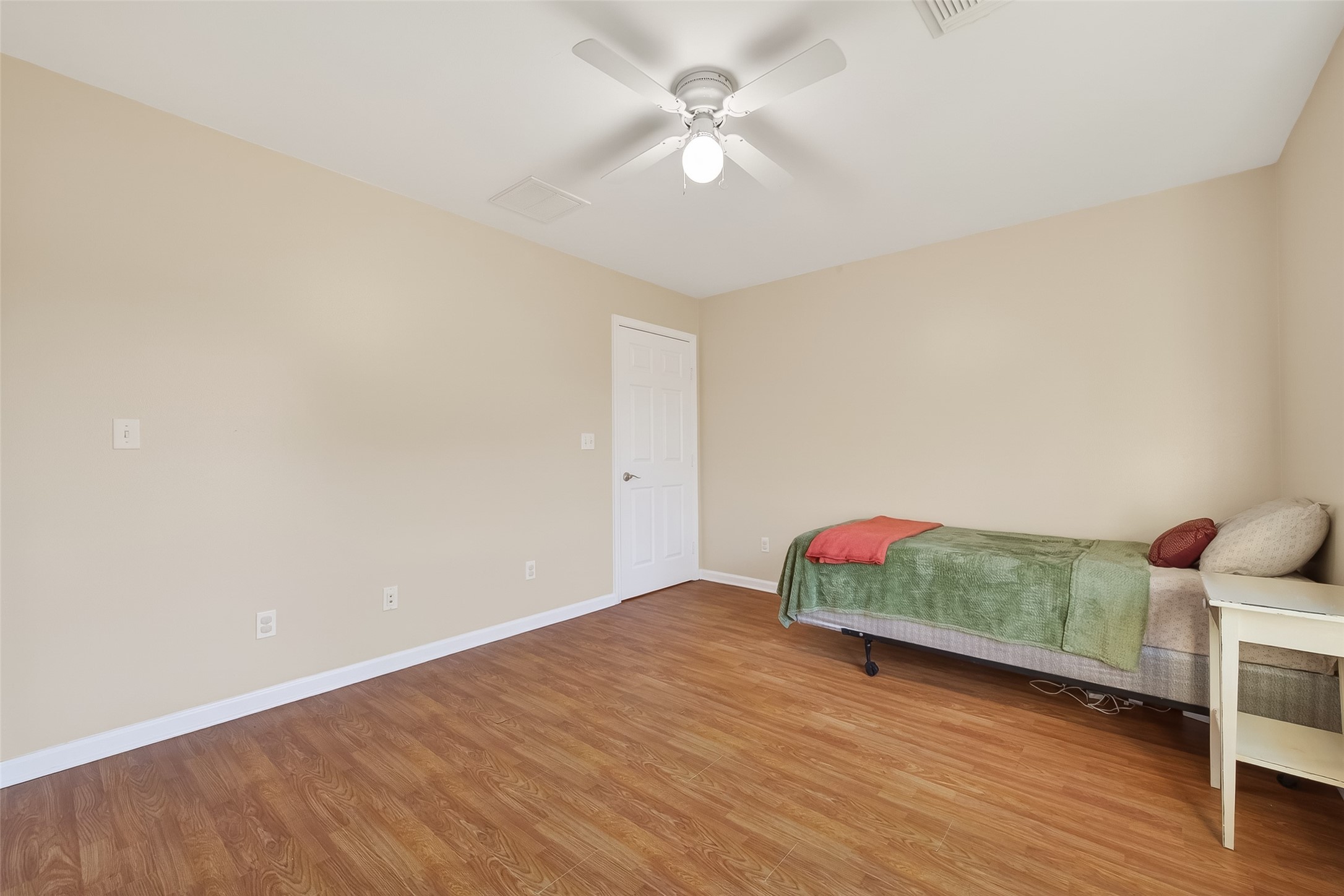 12415 Roesler Road Needville, TX 77461 - Photo 21 of 46 a living room with hard wood floors and a ceiling fan