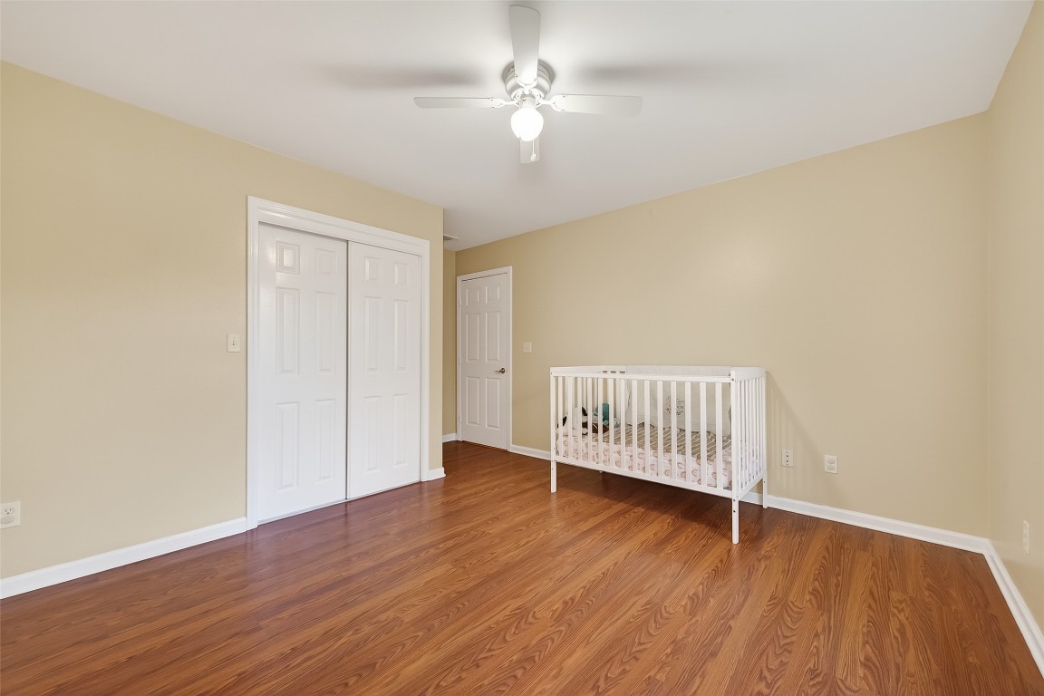 12415 Roesler Road Needville, TX 77461 - Photo 22 of 49 a view of livingroom with hardwood floor and a ceiling fan