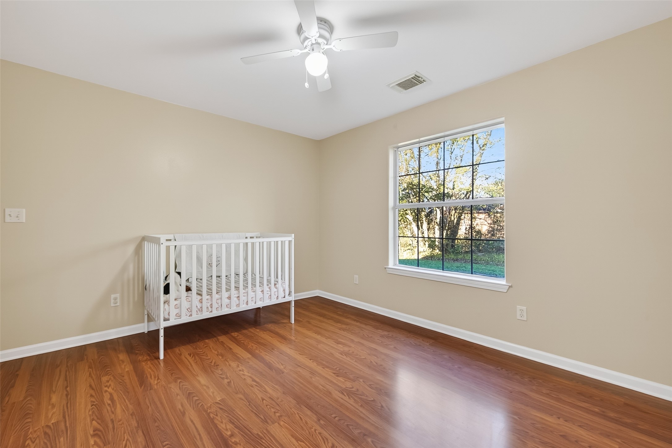 12415 Roesler Road Needville, TX 77461 - Photo 23 of 46 wooden floor in an empty room with a window