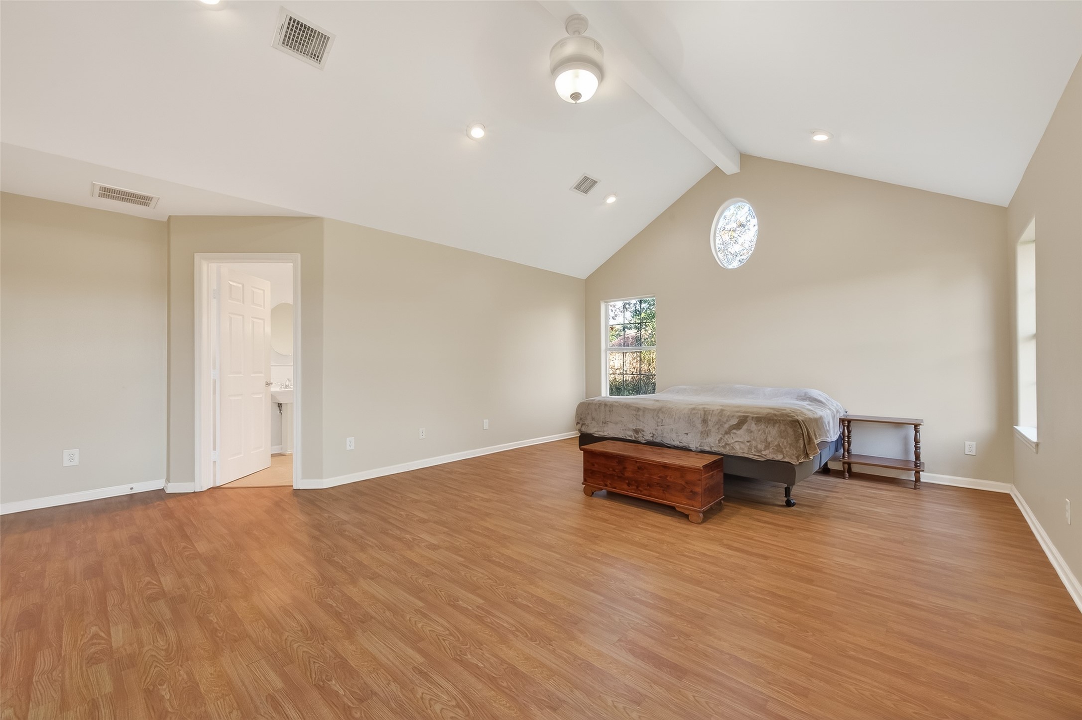 12415 Roesler Road Needville, TX 77461 - Photo 25 of 46 a spacious bedroom with a bed and a window