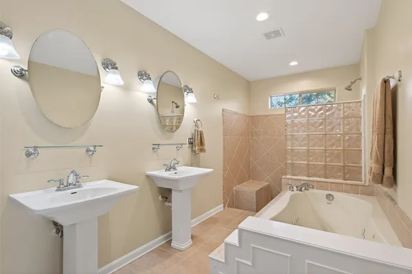 a bathroom with a bathtub and a toilet