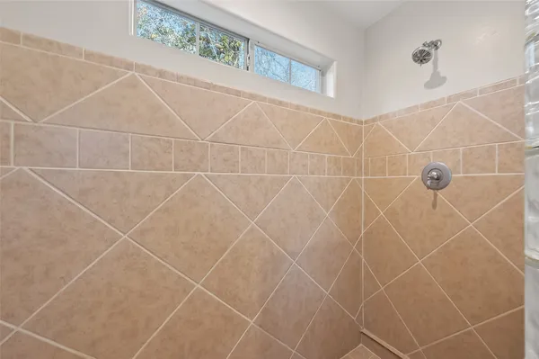 a bathroom with a bathtub and a sink