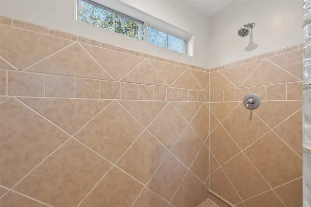 a bathroom with a bathtub and a sink