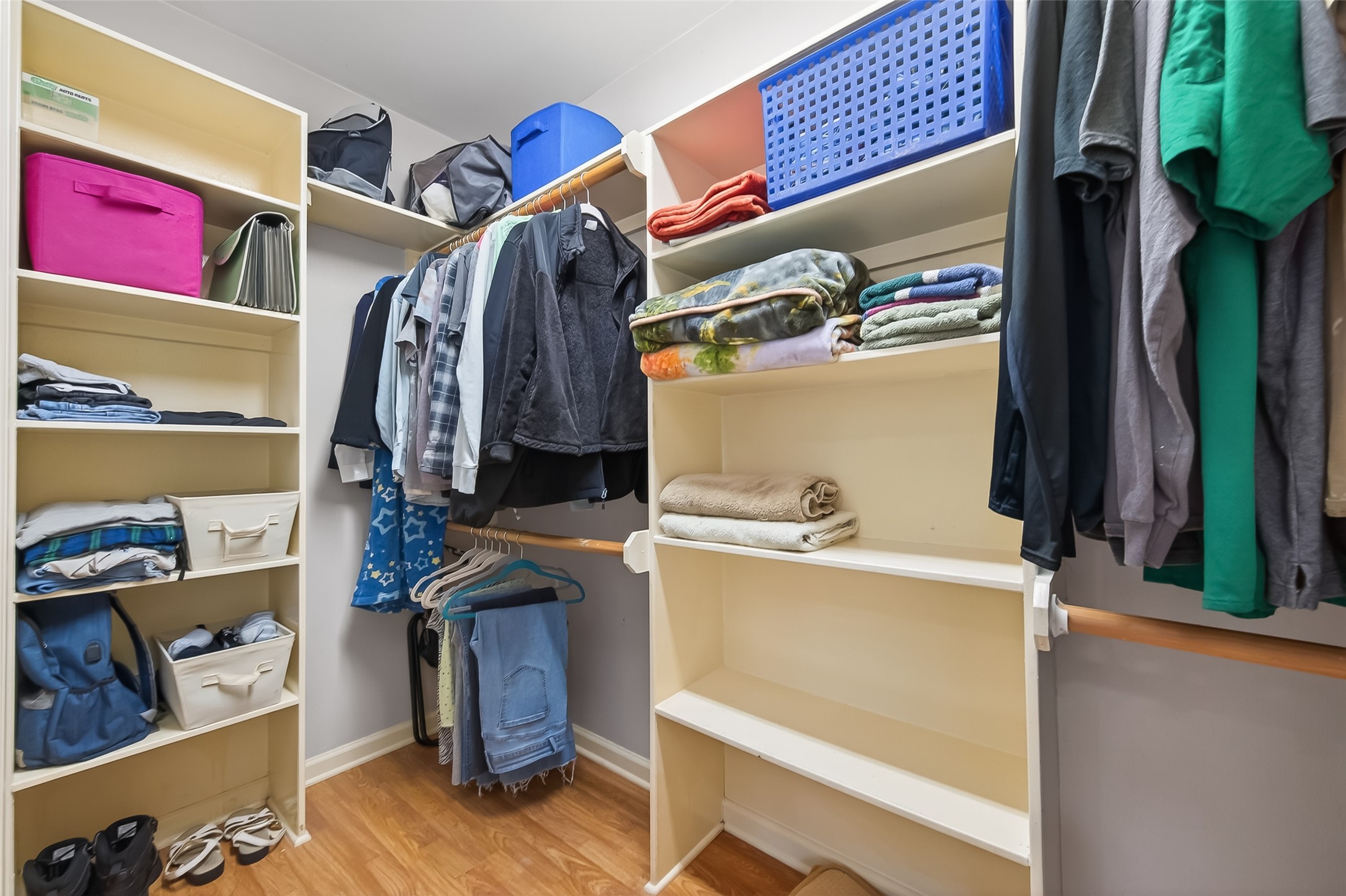 12415 Roesler Road Needville, TX 77461 - Photo 33 of 46 a view of walk in closet with clothes and shoes