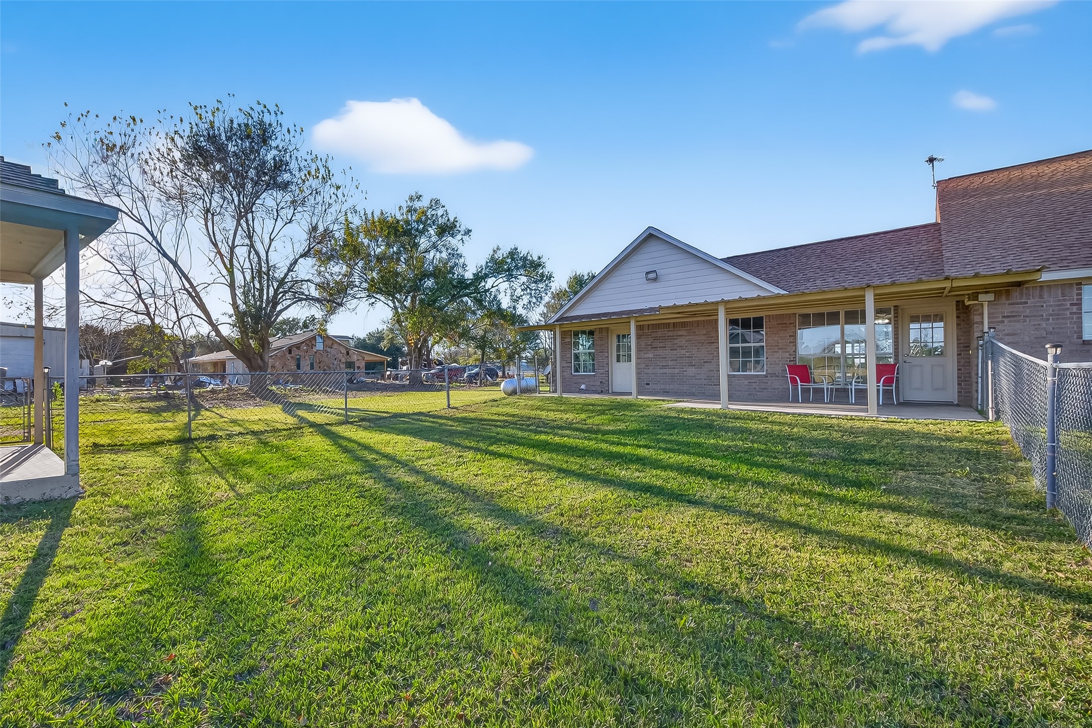 12415 Roesler Road Needville, TX 77461 - Photo 38 of 46 a front view of house with outdoor space and yard