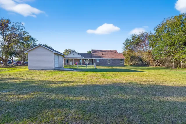 a view of an house with a yard