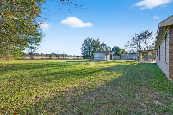 a house view with swimming pool in front of it