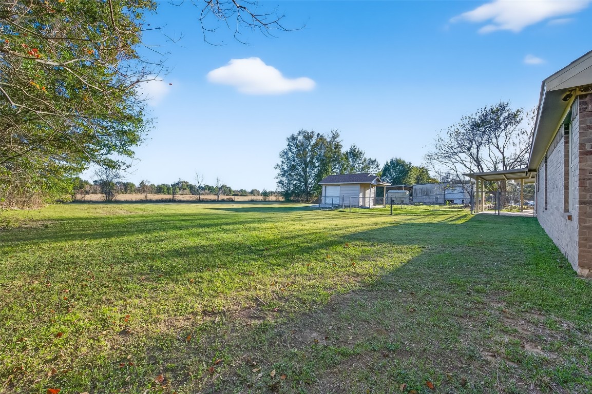 12415 Roesler Road Needville, TX 77461 - Photo 43 of 49 a view of a golf course with a lake