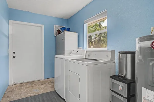 a view of room with stairs and a flat screen tv