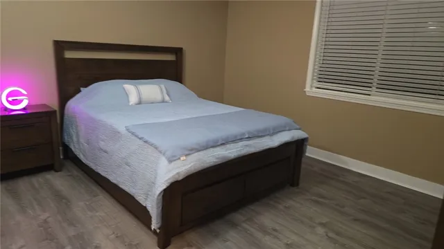 a bedroom with a bed and a closet