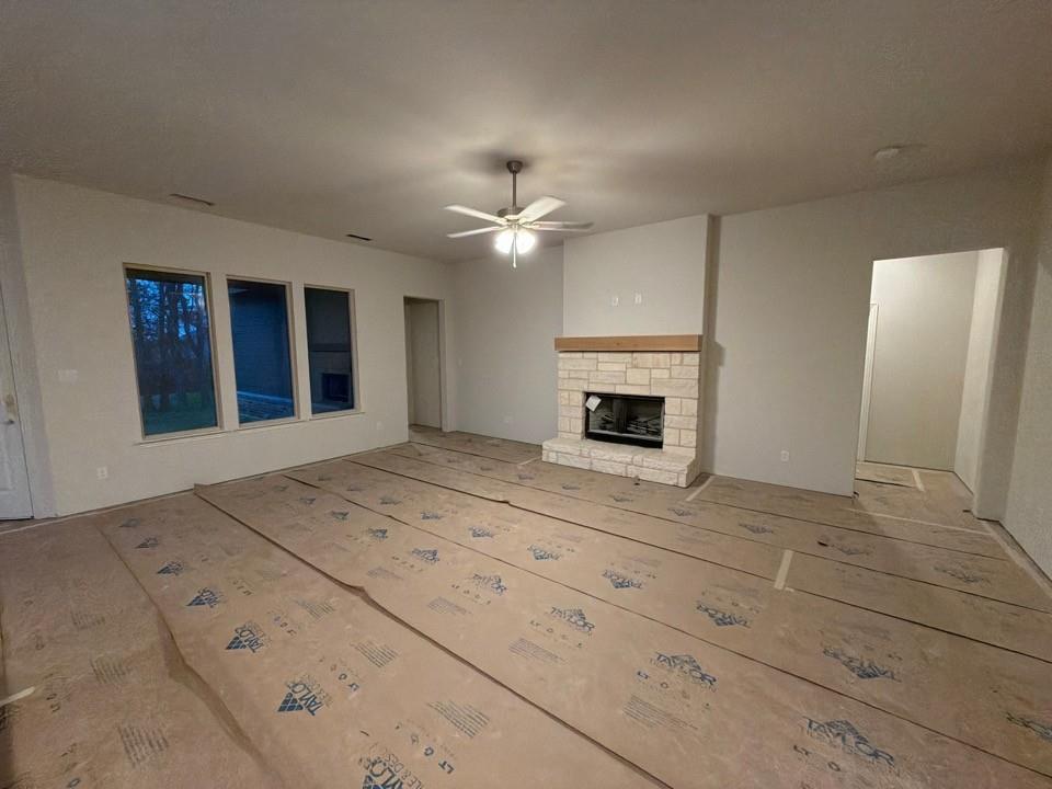 1132 Trinity Drive Springtown, TX 76082 - Photo 4 of 11 a view of an empty room with a fireplace