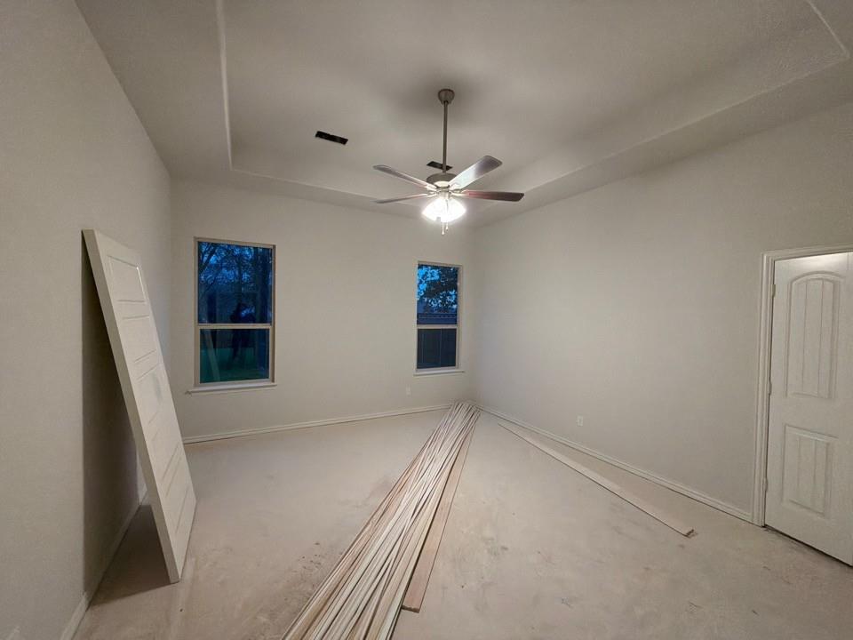 1132 Trinity Drive Springtown, TX 76082 - Photo 7 of 11 wooden floor in an empty room with a window